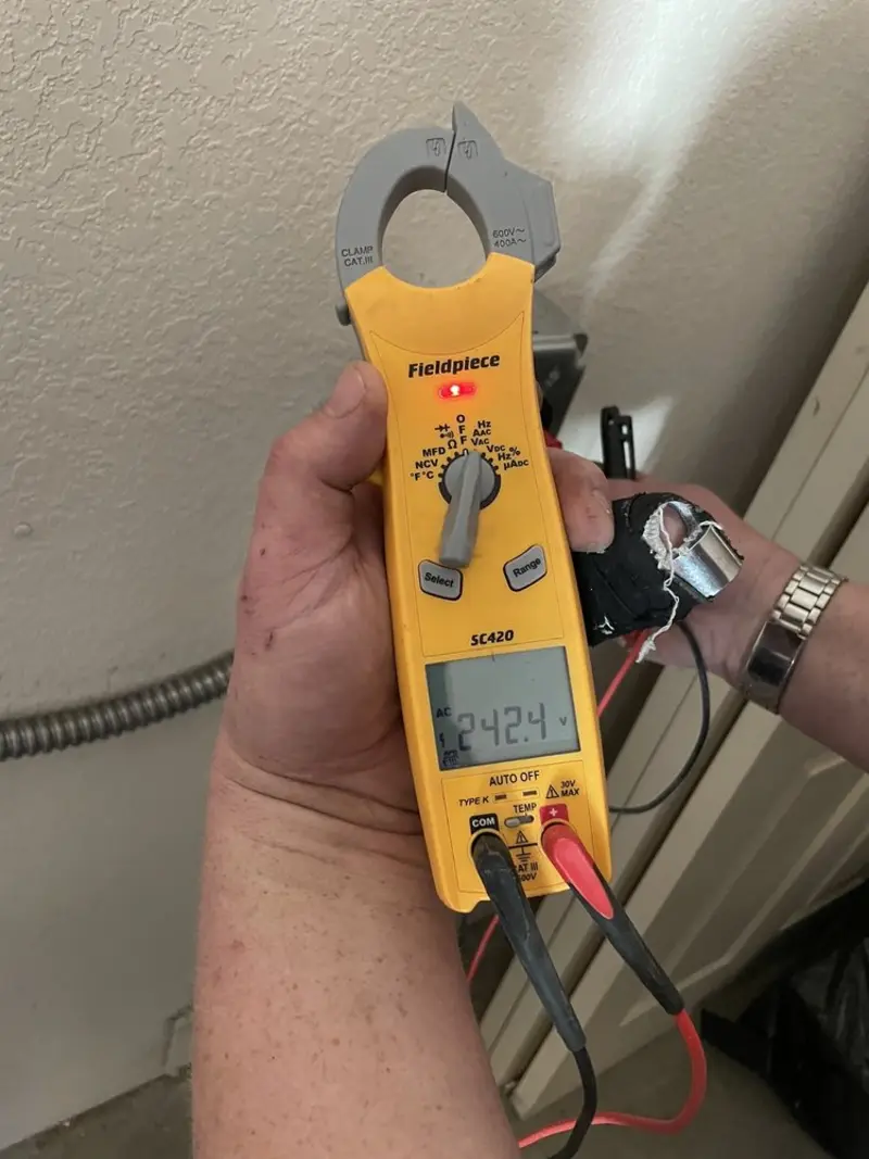 Voltage testing with clamp meter during Ceiling Fan Installation in Paramus